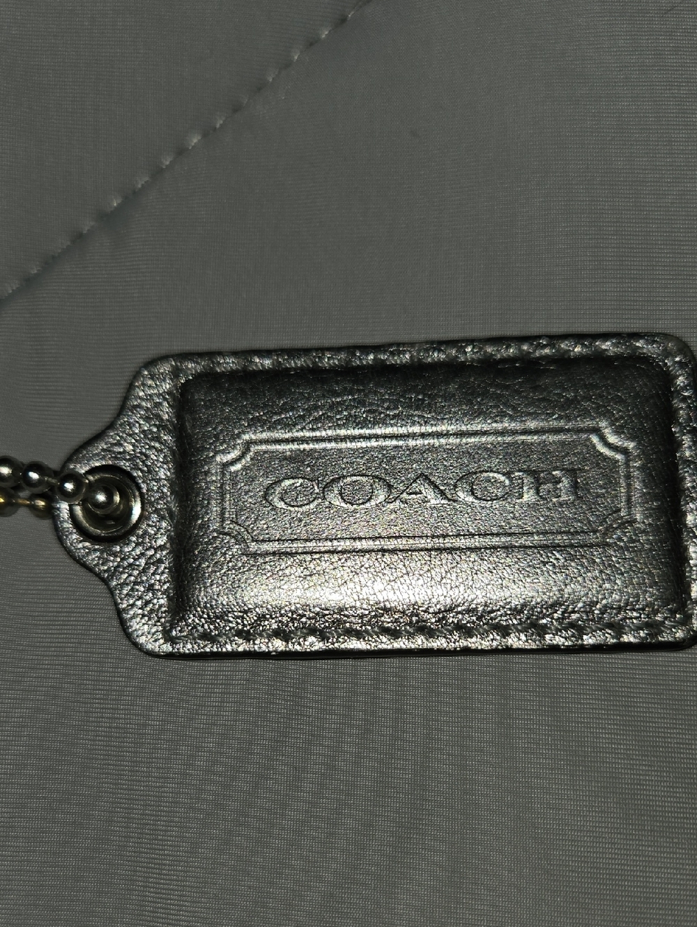 Coach Metallic Silver Leather Logo Tag